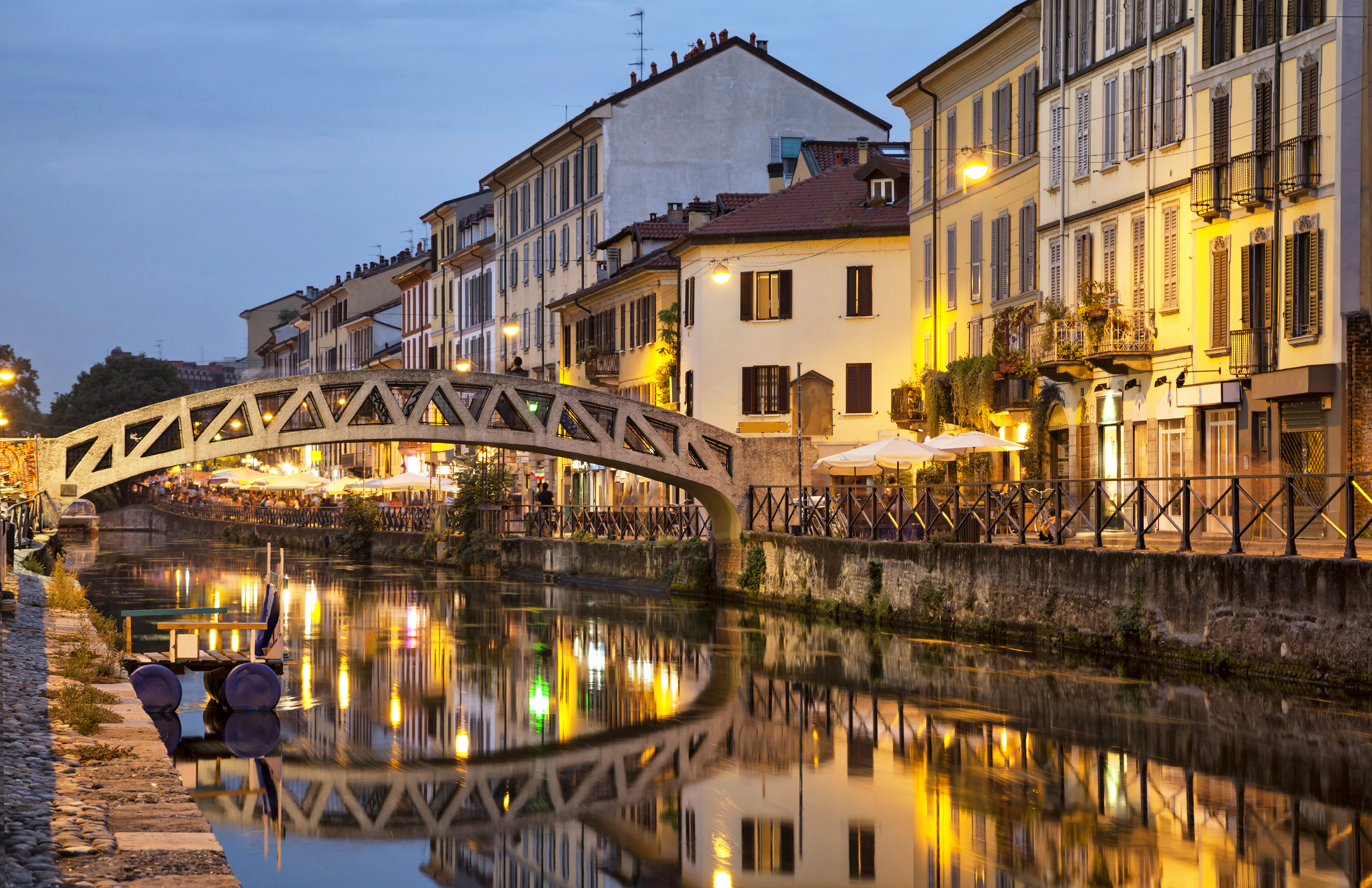 Bridge across the Naviglio Grande canal at the evening in Milan, Italy